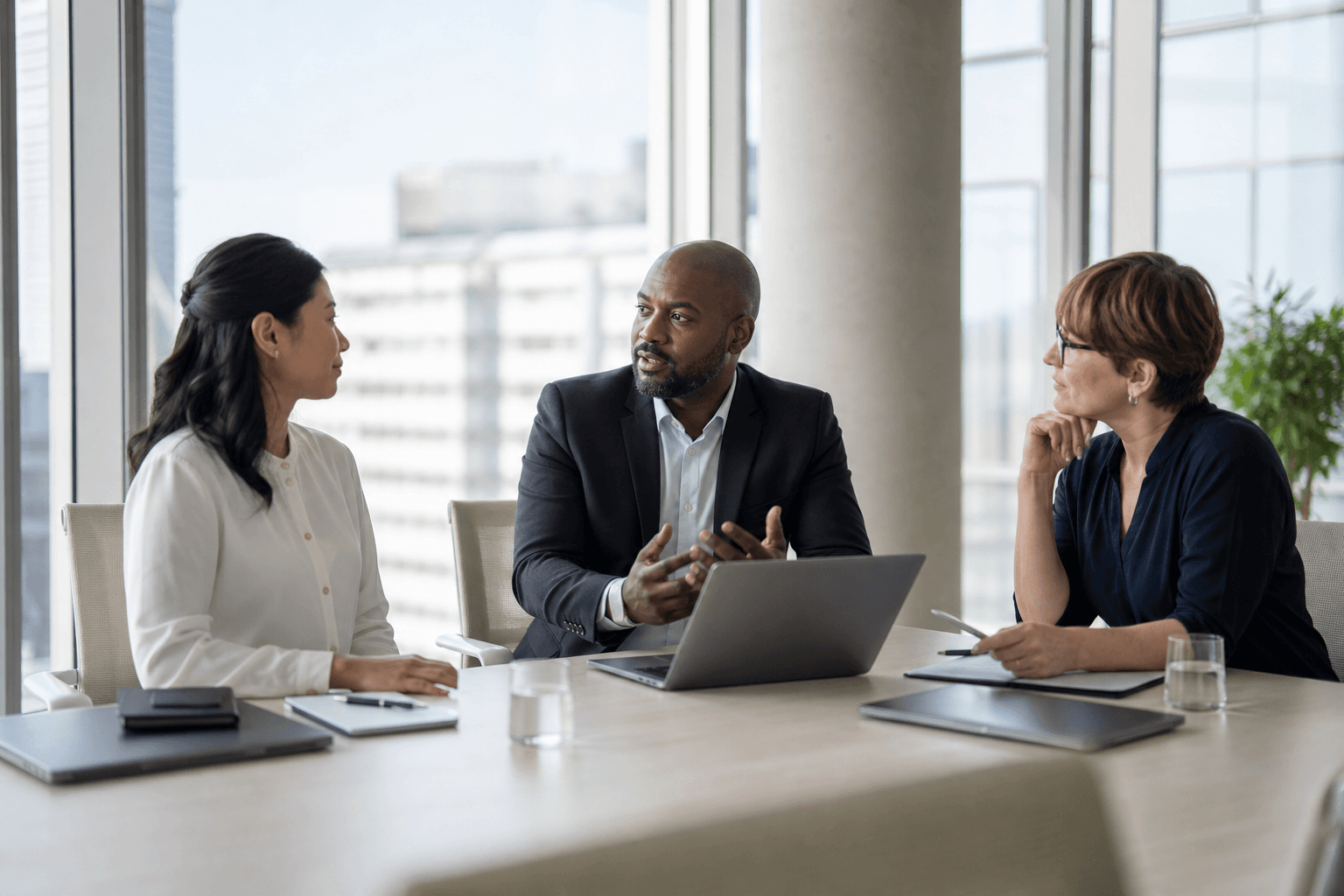 Partners collaborating in a bright modern meeting room